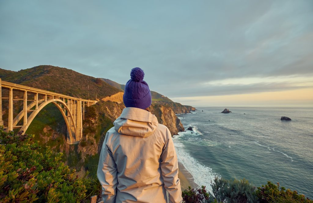 Woman tourist near Bixby Creek Bridge in California